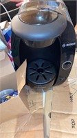 Working tassimo coffee maker with coffee pods.