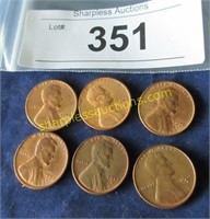 Six uncirculated wheat pennies.