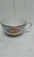 hand painted Nissan tea cup. gold accents and