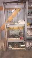 Metal display rack with misc welding rods and