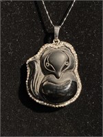 Black onyx fox surrounded by rhinestones on a