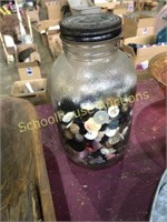 Old glass peanut jar of buttons