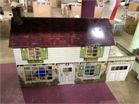 Large tin dollhouse with plastic furniture