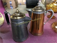 2 metal tea/coffee pots. Silver has minor rust