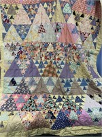 Old patchwork style quilt in good condition
