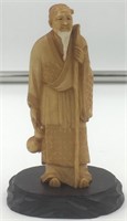 Old ivory carving of a man with white beard, a gou
