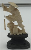 Ivory carving of a fisherman, rod has been broken