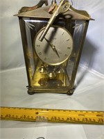 SMALL GLASS AND BRASS WIND UP CLOCK