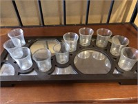 Tea light holders on wooden mirrored base