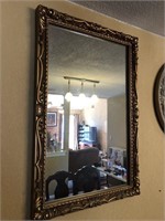 Wall mirror in ornate frame