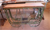 Green metal rolling cart with wooden top