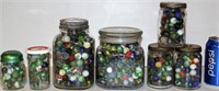 7 Jars of Assorted Glass Marbles