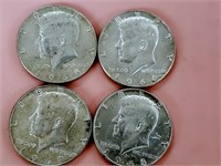John Kennedy half dollar coins. (4)