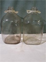 Glass gallon Milk jugs.