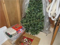Two boxes of Christmas decorations and tree