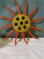 Painted rotary hoe wheel.