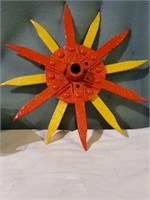 Sunburst rotary hoe wheel.