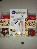 WILTON COOKIE PRESS AND 2 PKS. COOKIE CUTTERS