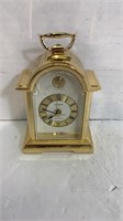 small goldtone clock