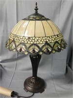 Bronze base electric lamp with domed stained glass