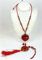 TWO RED AGATE PENDANTS - YEAR OF THE PIG & RAT