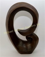 CARVED WOOD SCULPTURE IN THE STYLE OF HENRY MOORE