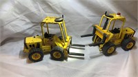 Two Tonka fork lifts