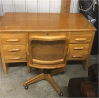 Oak Desk and Cane Back Roll Around Office Chair
