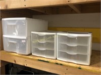 Assorted small plastic storage drawers