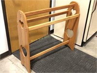 Solid oak quilt rack with heart cutouts