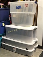 Group of five plastic storage totes