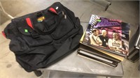 Roll Around Duffle Bag and Collectible Books,