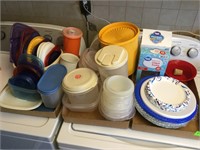Three boxes of Tupperware, paper plates, plastic