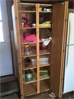 Two door homemade wooden cabinet and contents
