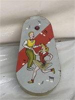Vintage party noise maker with dancers on front