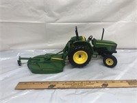 John Deere toy tractor and plow