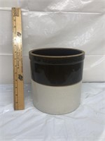 Brown and white stoneware crock small crack inside