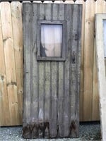Old vintage barn door with window