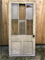 Wood door with three window panes missing three