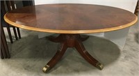 Wooden oval coffee table measures 48x27x18
