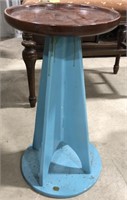 Wooden plant stand with turquoise colored bottom,