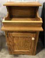 Small storage cabinet with produce storage on