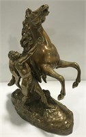 Coustou man and horse metal sculpture