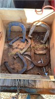 Four Sets of Horseshoes and Crate