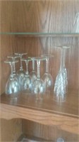 Clear glass stemware in the upper part of the