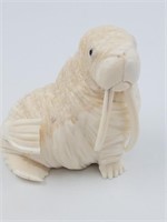 Outrageous ivory carving of a walrus by Dennis Pun