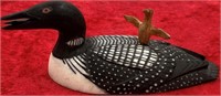 Scrimshawed ivory carving of a common loon with ch