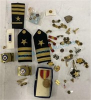 Grouping of military pins and insignias