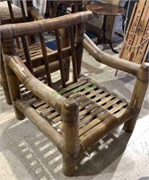 Antique extra large bamboo arm chair. Measures 38