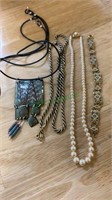 3 costume necklaces and a Spanish Toledo